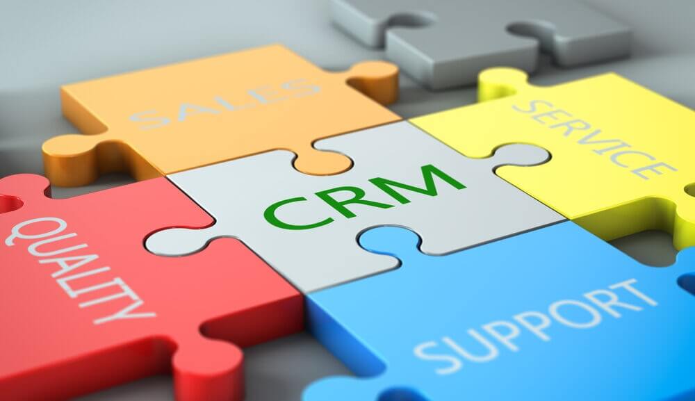 a puzzle piece with the word CRM on it.